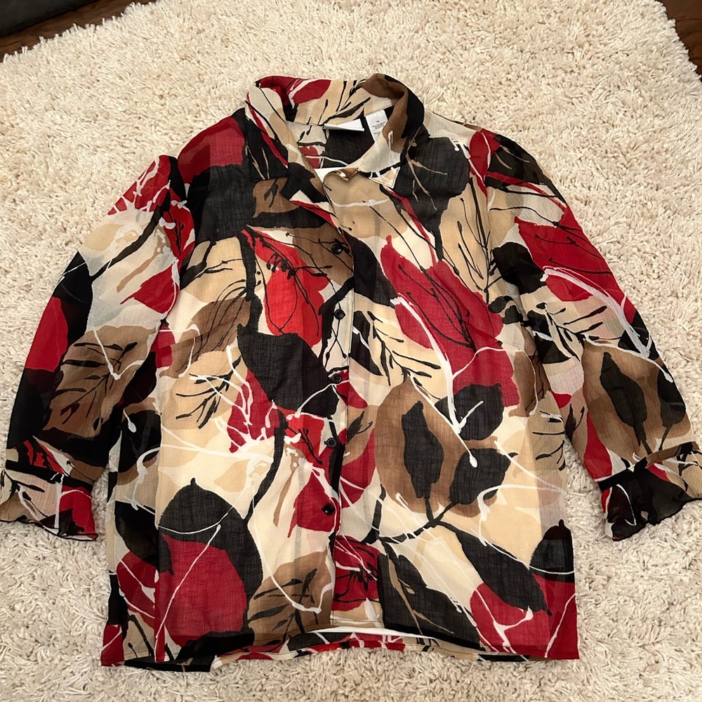 Alfred Dunner size 14 women’s blouse with three-quarter length ruffled sleeves.